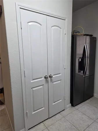 a bathroom with a glass shower door