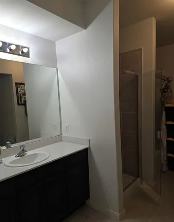 a bathroom with a sink and a mirror