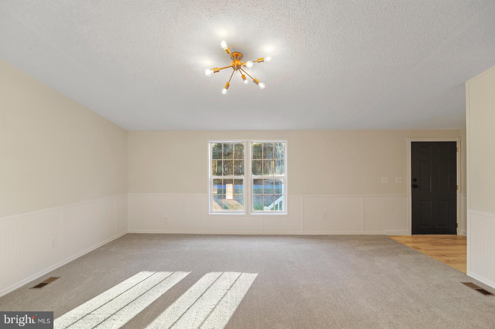 16745 Arvey Road Laurel, DE 19956 - Photo 19 of 35 wooden floor in an empty room with a window