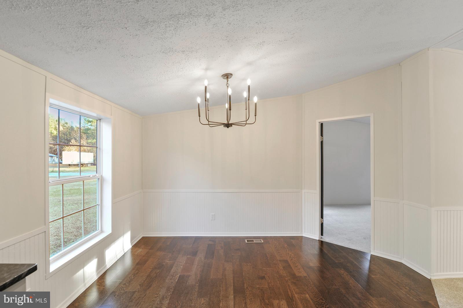 16745 Arvey Road Laurel, DE 19956 - Photo 27 of 35 wooden floor in an empty room with a window