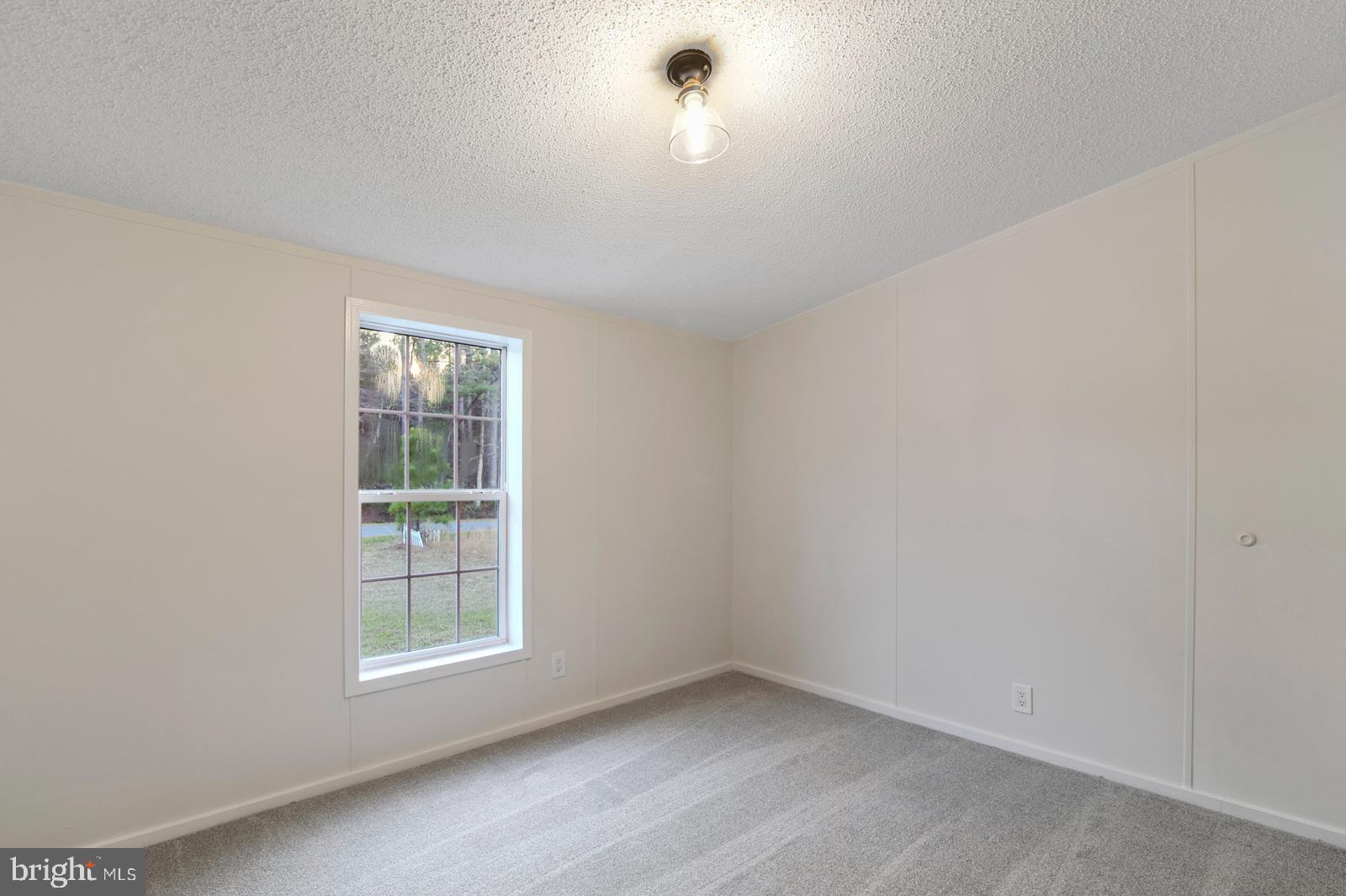 16745 Arvey Road Laurel, DE 19956 - Photo 32 of 35 an empty room with a window