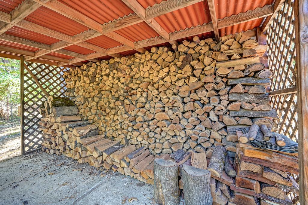 7040 Goferbroke Road Georgetown, CA 95634 - Photo 46 of 50 Tons of stacked wood ready for the wood stove