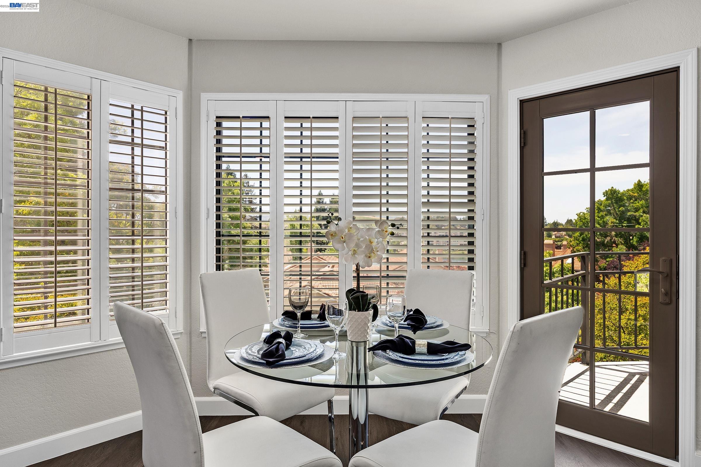 5012 Lakeview Drive, Unit 200 San Ramon, CA 94582 - Photo 11 of 47 a dining room with furniture a large window and a potted plant
