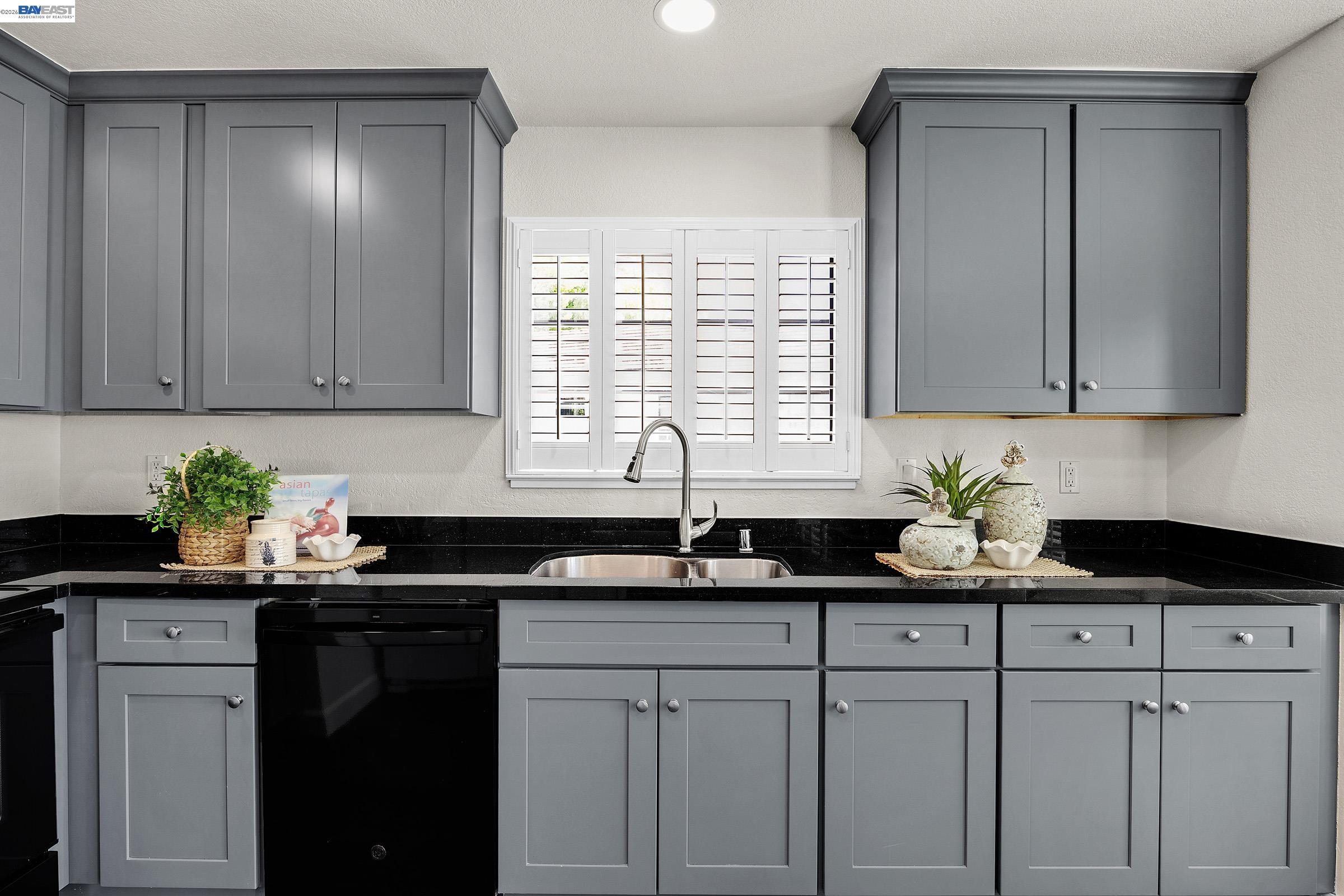 5012 Lakeview Drive, Unit 200 San Ramon, CA 94582 - Photo 13 of 47 a kitchen with granite countertop white cabinets sink and window