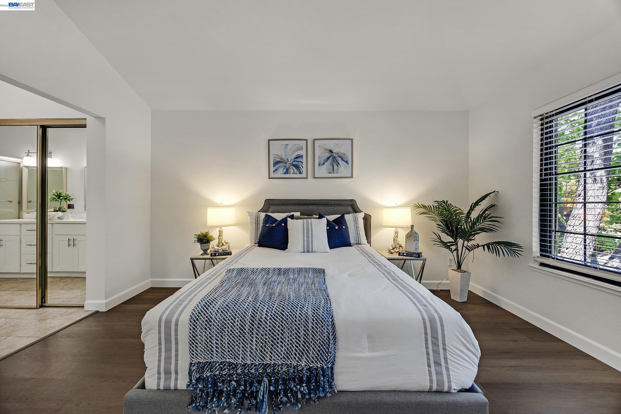 5012 Lakeview Drive, Unit 200 San Ramon, CA 94582 - Photo 18 of 47 a bedroom with a large bed and a window