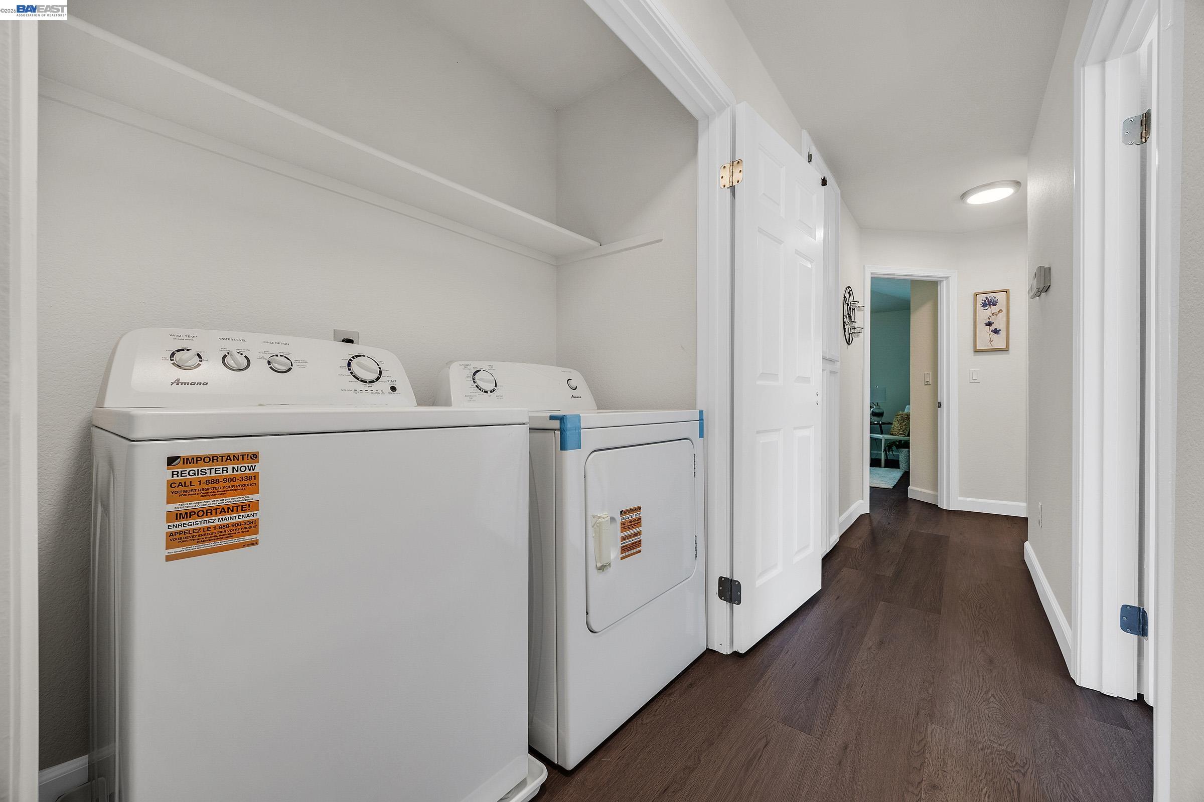 5012 Lakeview Drive, Unit 200 San Ramon, CA 94582 - Photo 27 of 47 a view of washer and dryer with wooden floor