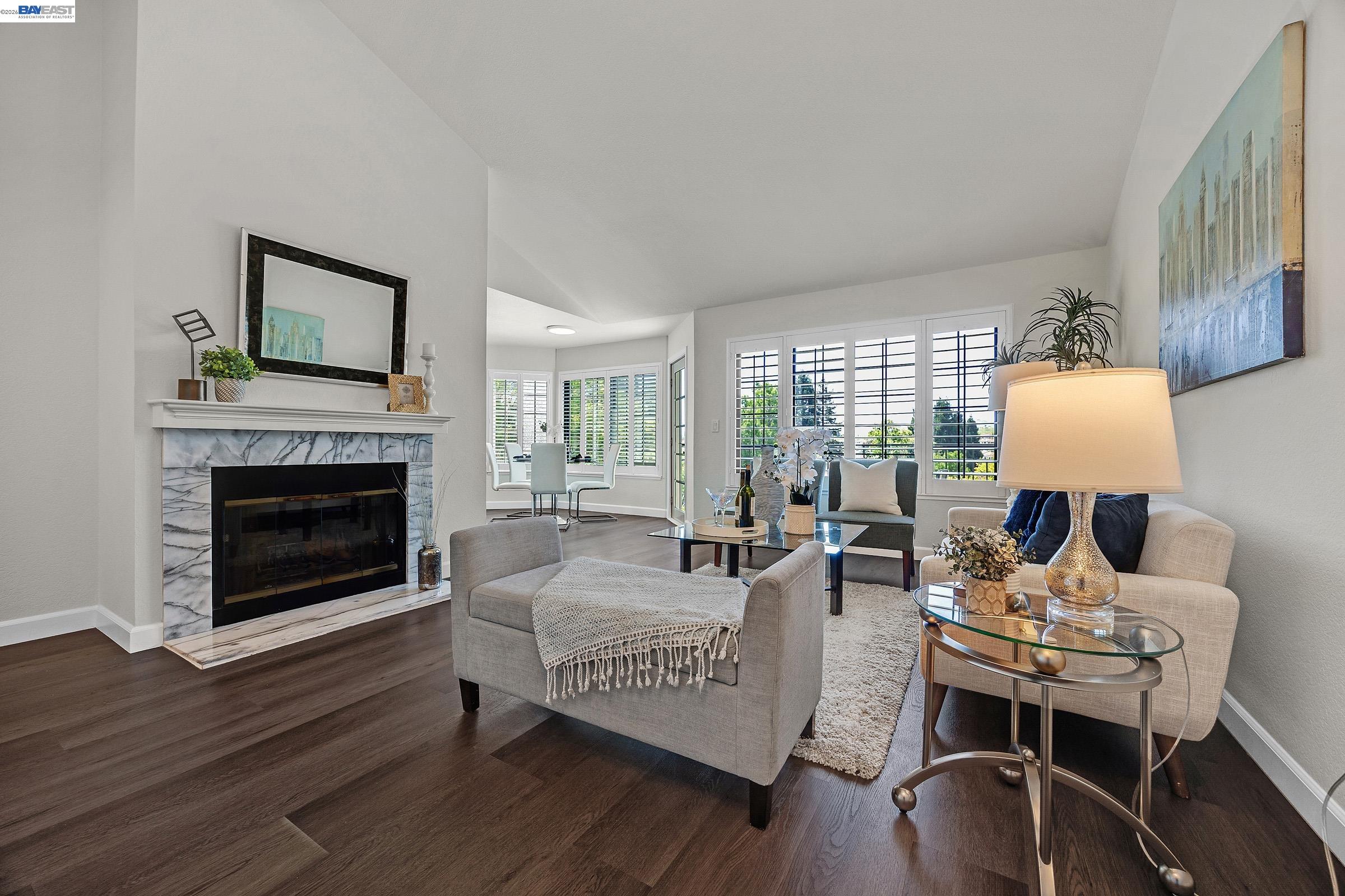 5012 Lakeview Drive, Unit 200 San Ramon, CA 94582 - Photo 3 of 47 a living room with furniture wooden floor and a fireplace