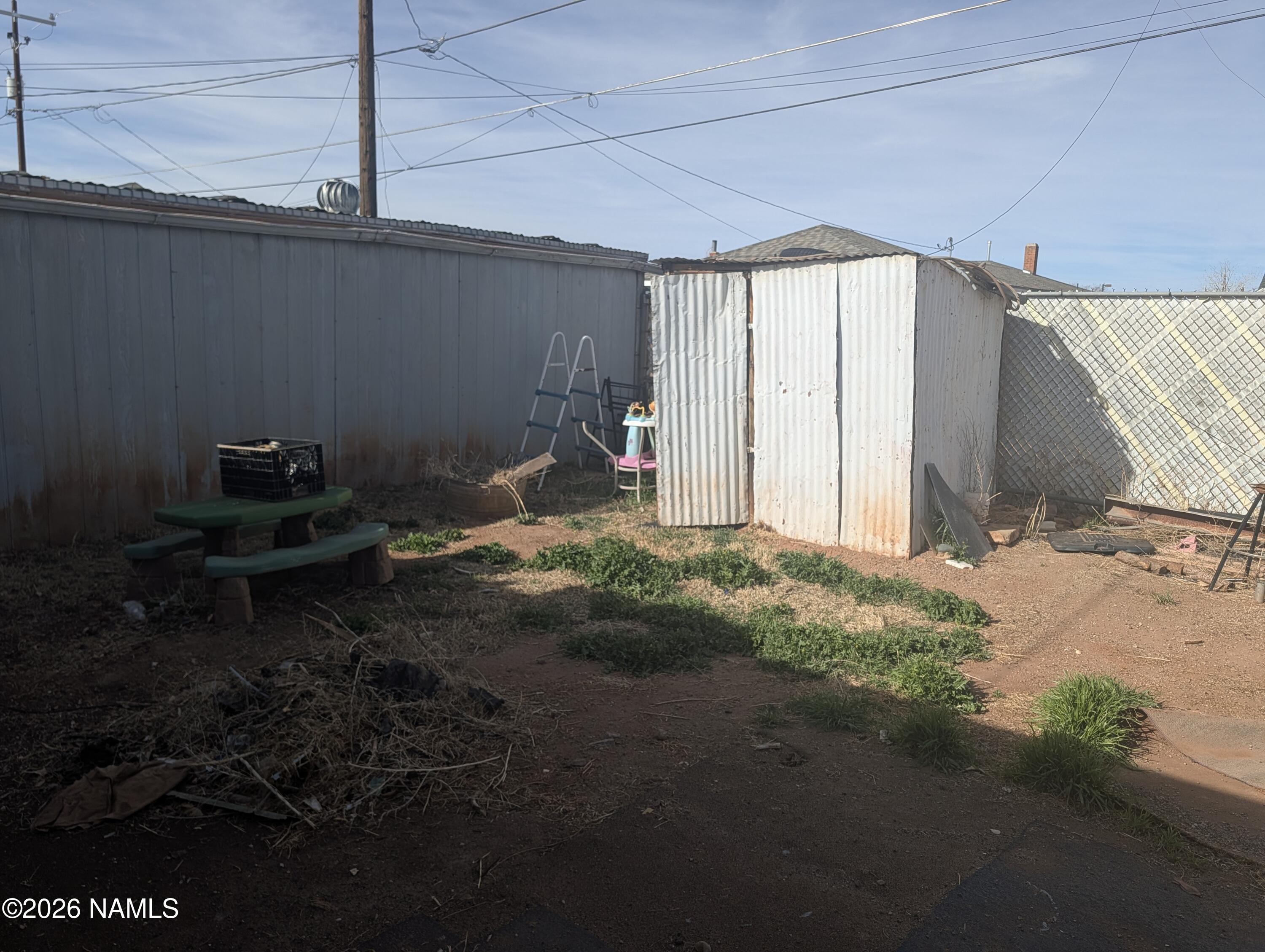 700 West Maple Street Winslow, AZ 86047 - Photo 13 of 15 a backyard of a house