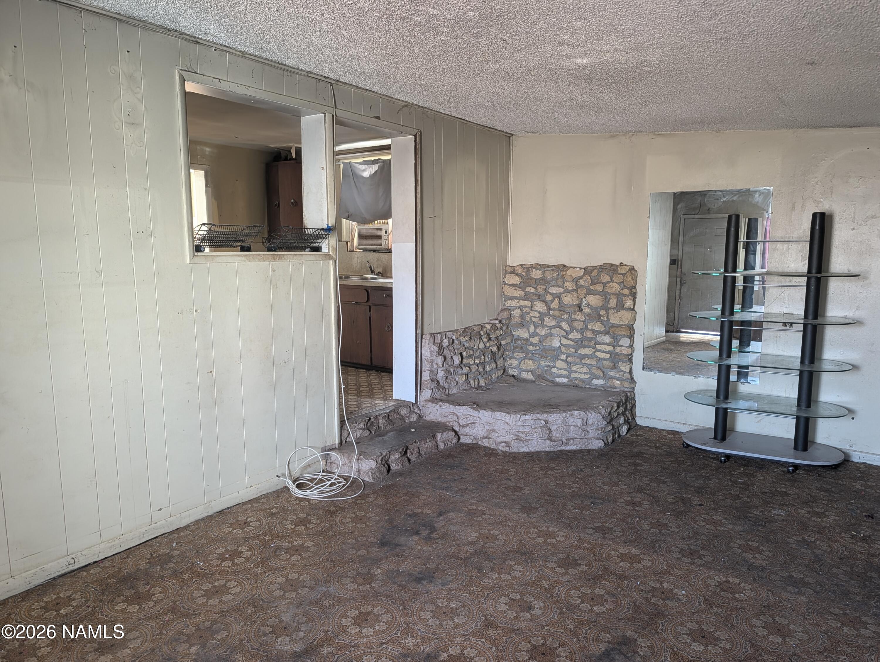 700 West Maple Street Winslow, AZ 86047 - Photo 8 of 15 a view of an empty room with closet and cabinet