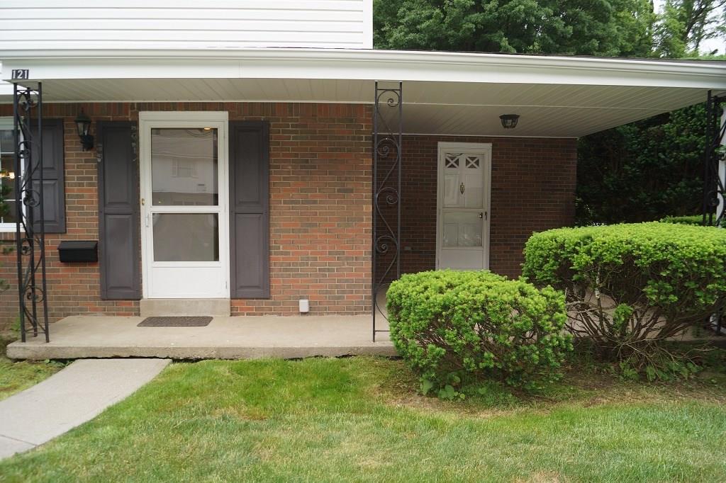 121 Kingsdale Road Pittsburgh, PA 15221 - Photo 12 of 25 The front of the house with 2 doors and a covered porch area.