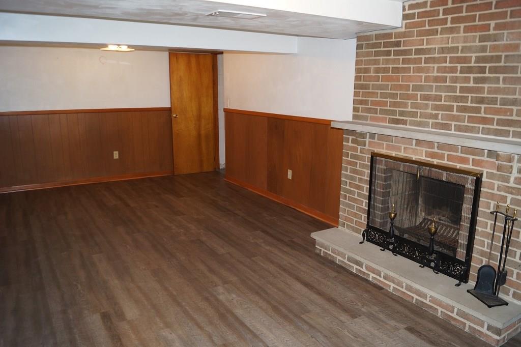 121 Kingsdale Road Pittsburgh, PA 15221 - Photo 21 of 25 New laminate flooring was just installed.