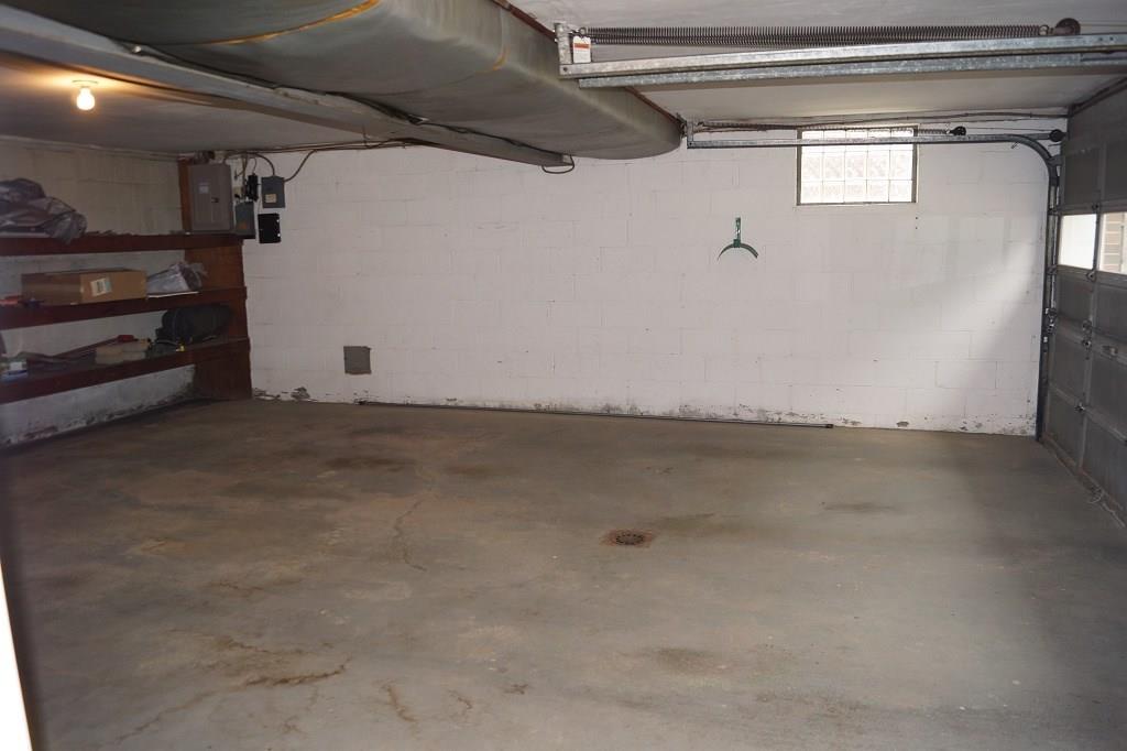 121 Kingsdale Road Pittsburgh, PA 15221 - Photo 23 of 25 Large 2 car garage with tons of shelving space for storing all your stuff.