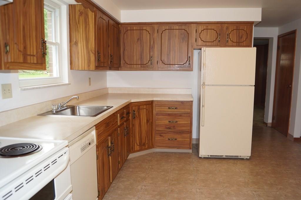 121 Kingsdale Road Pittsburgh, PA 15221 - Photo 7 of 25 Eat-in kitchen equipped with a electric stove with a double oven.