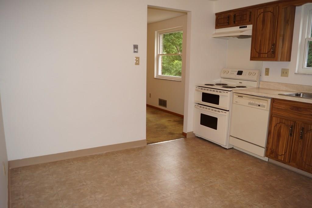 121 Kingsdale Road Pittsburgh, PA 15221 - Photo 8 of 25 Plenty of room for an eat-in area or possibly adding new cabinets to the space.