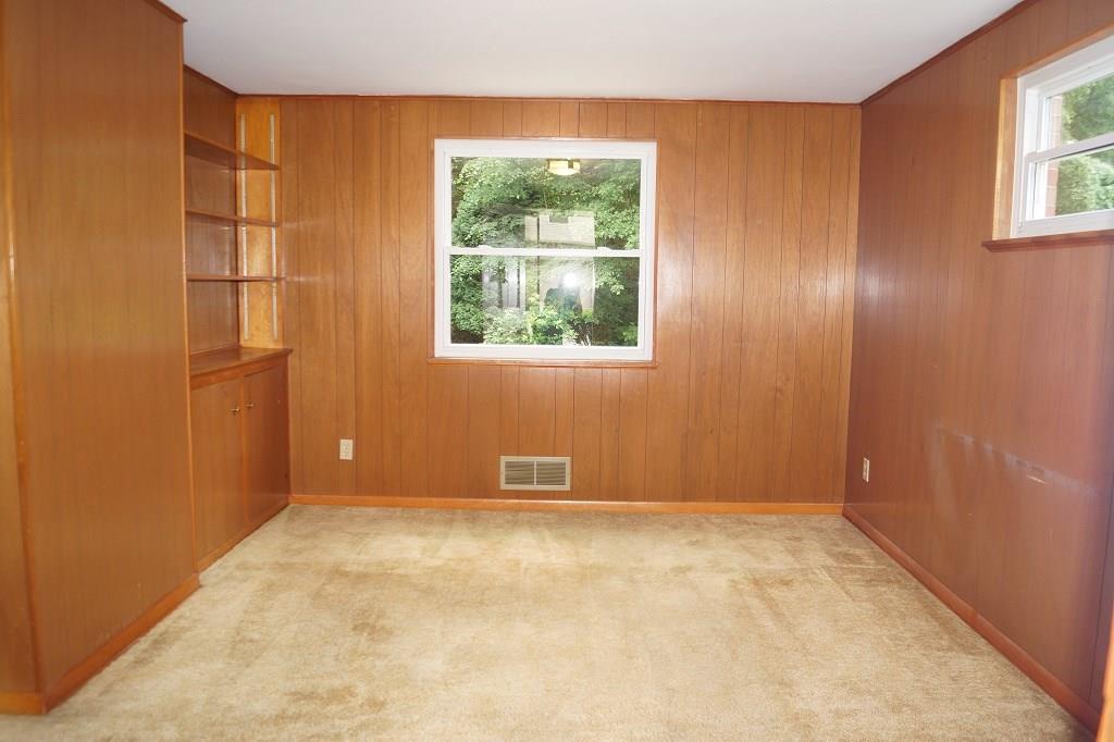 121 Kingsdale Road Pittsburgh, PA 15221 - Photo 10 of 25 Family room den leads to the front porch. This room also has hardwood under the carpet.