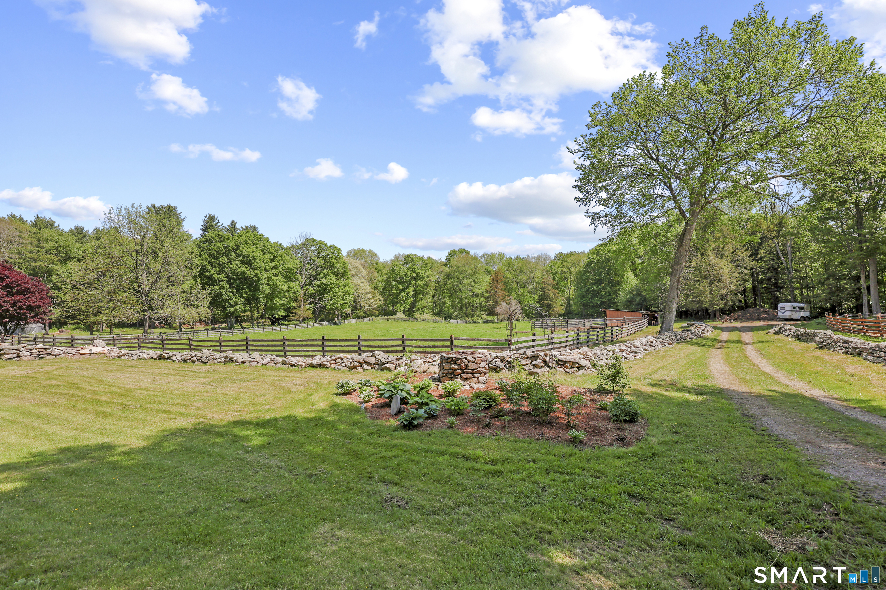 2880 Main Street Coventry, CT 06238 - Photo 32 of 40 Wide driving pathway from motor courtyard back to paddocks, run-in shed, and pond.