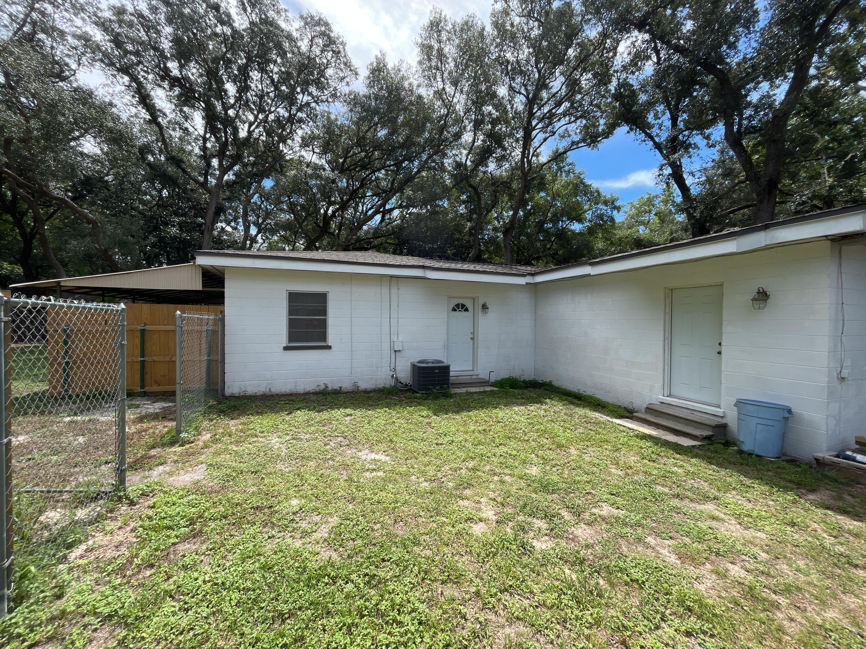 44 Meigs Drive Shalimar, FL 32579 - Photo 13 of 14 a backyard of a house with lots of green space