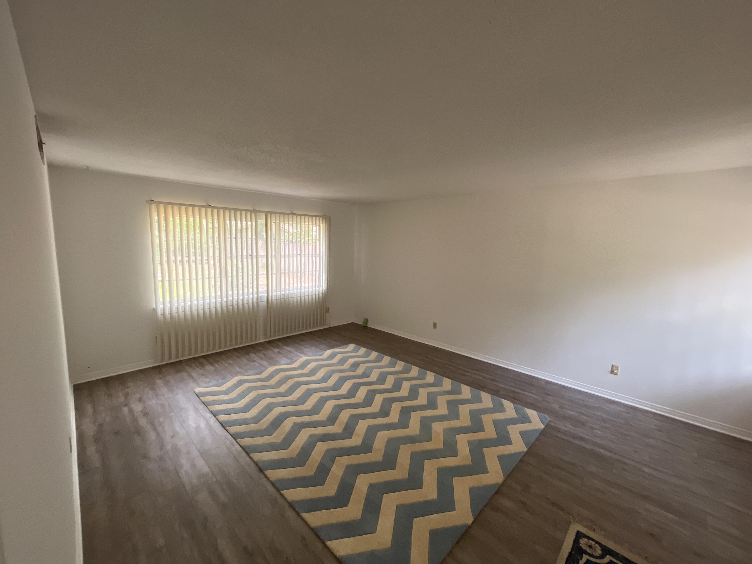 44 Meigs Drive Shalimar, FL 32579 - Photo 2 of 14 an empty room with wooden floor and windows