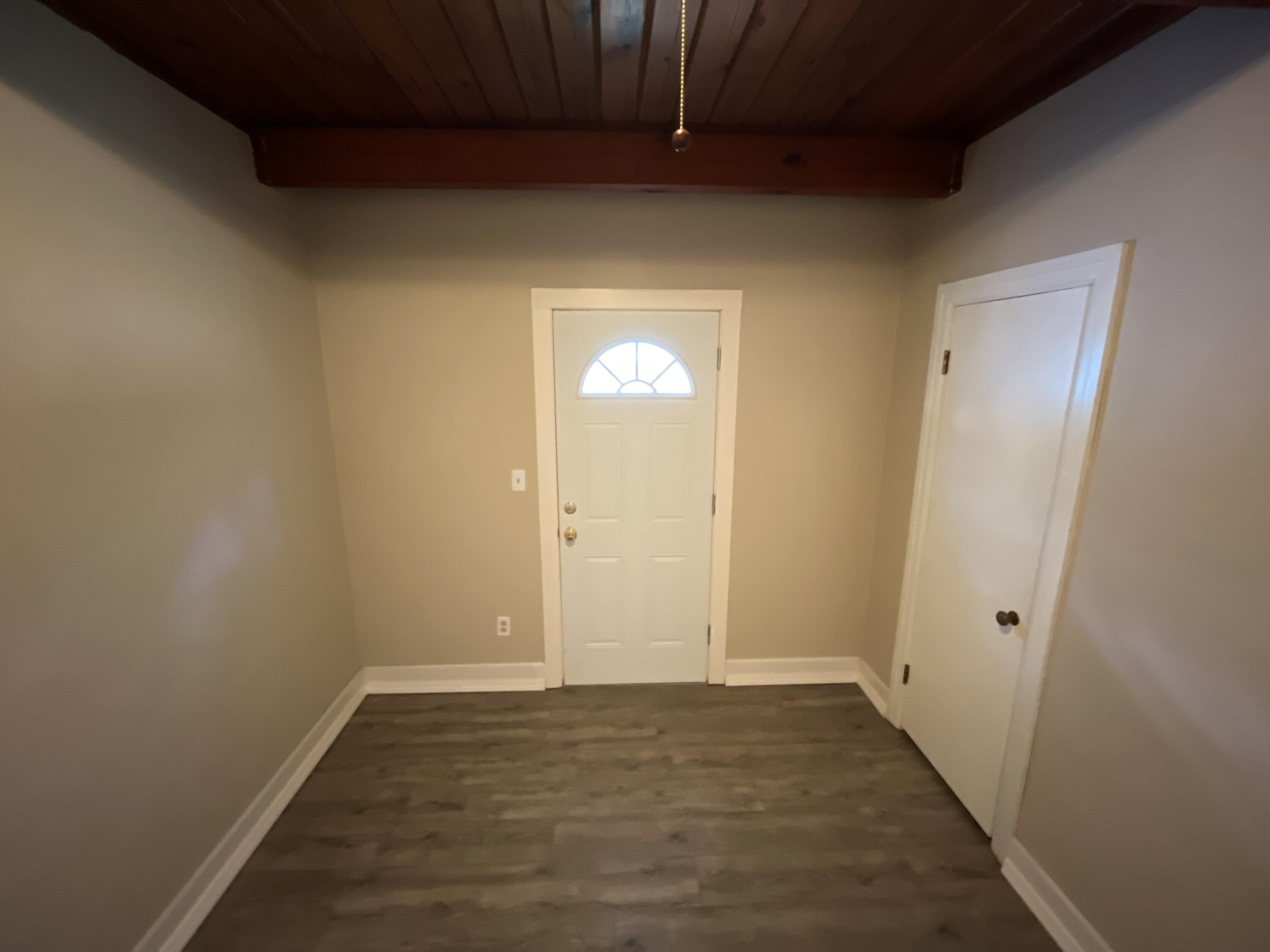 44 Meigs Drive Shalimar, FL 32579 - Photo 9 of 14 a view of an empty room with wooden floor