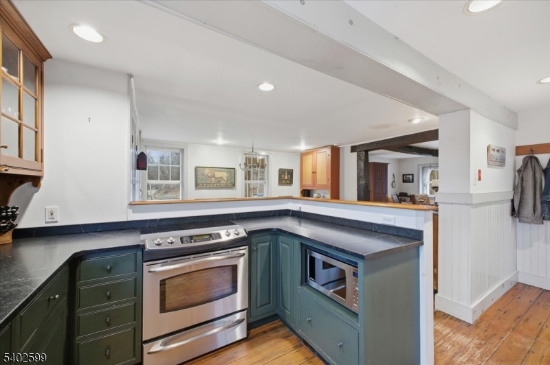 17 Old River Road Milford, NJ 08848 - Photo 16 of 46 a kitchen with stainless steel appliances granite countertop a stove and a sink