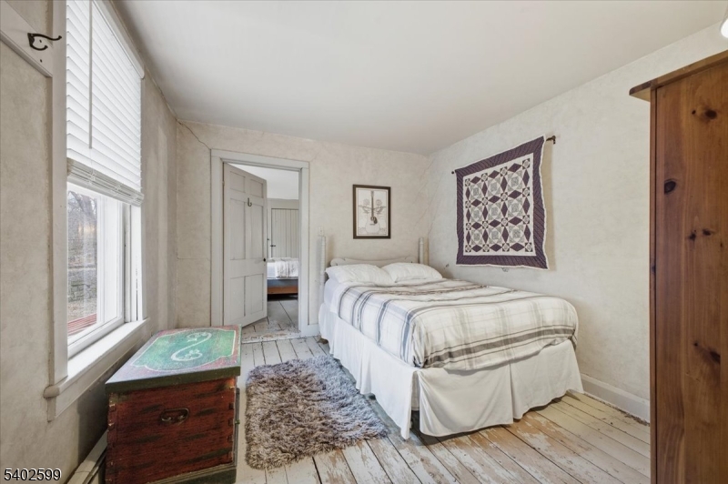 17 Old River Road Milford, NJ 08848 - Photo 22 of 46 a bedroom with a bed and wooden floor