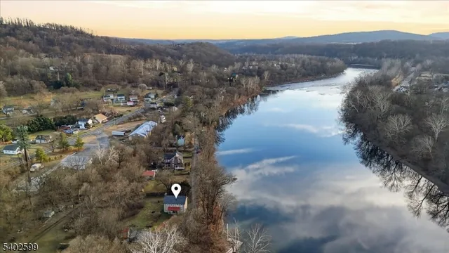 a view of a lake in middle of forest