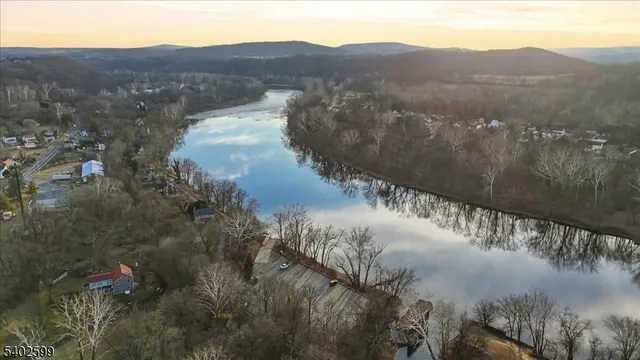 a view of a lake in middle of forest