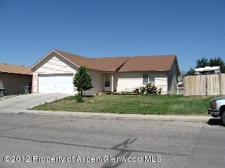 2519 Acacia Avenue Rifle, CO 81650 - Photo 1 of 1 a front view of a house with a yard
