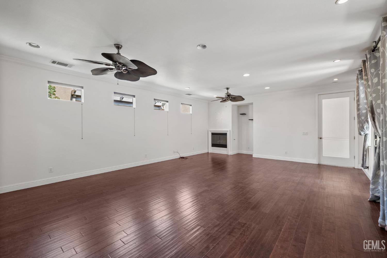 Undisclosed Address Bakersfield, CA 93306 - Photo 13 of 54 a view of empty room with wooden floor