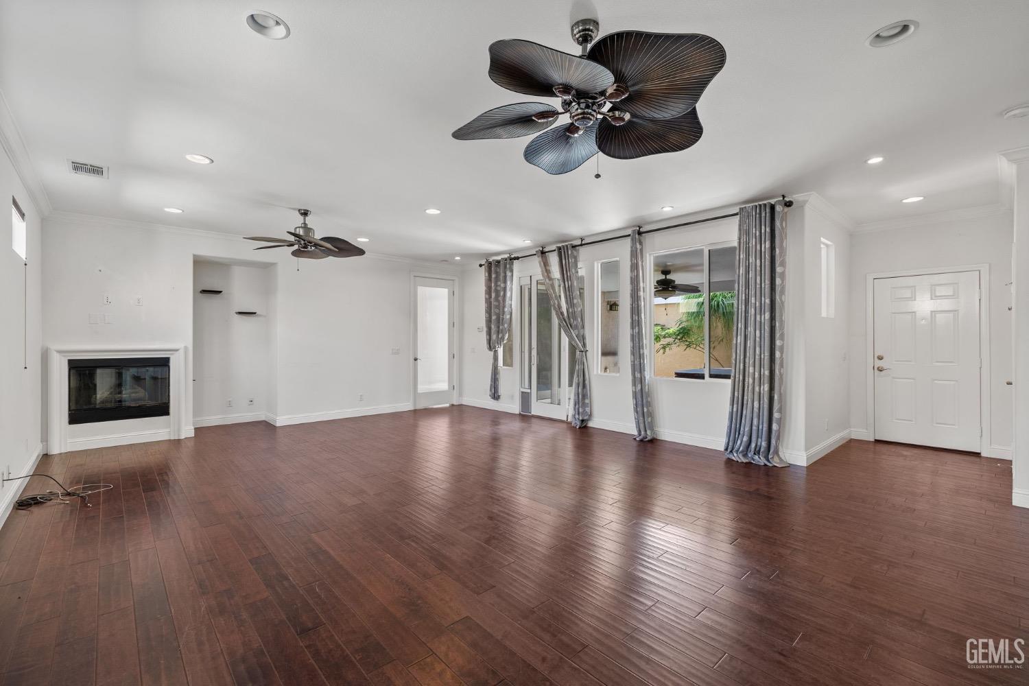 Undisclosed Address Bakersfield, CA 93306 - Photo 14 of 54 a view of an empty room and wooden floor