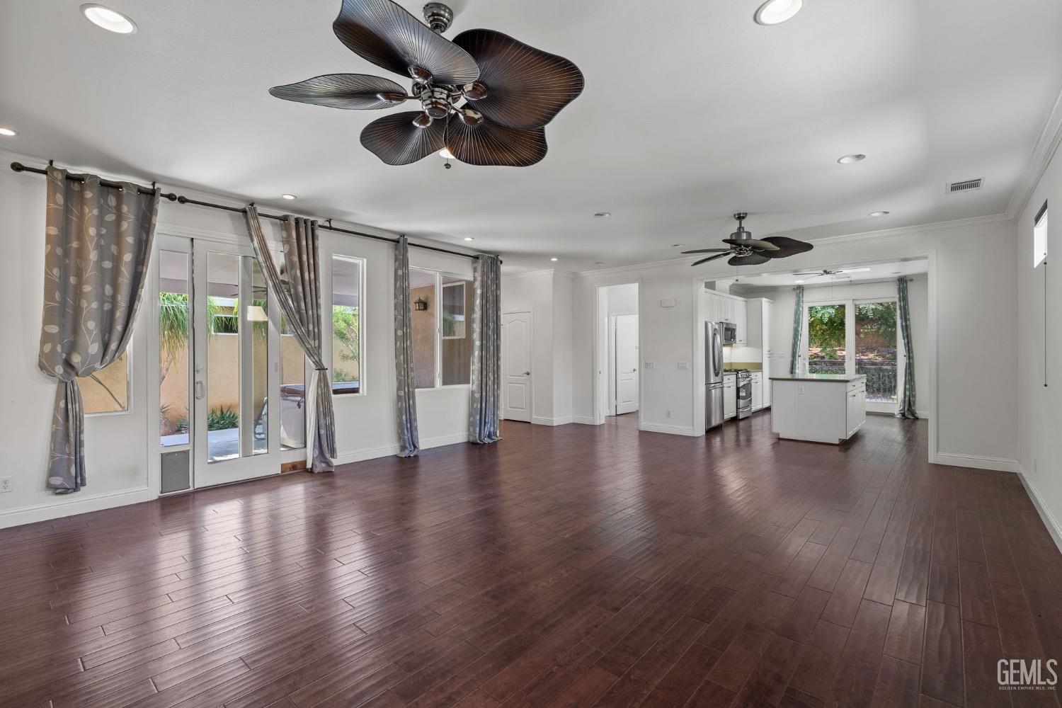 Undisclosed Address Bakersfield, CA 93306 - Photo 17 of 54 a view of an empty room with wooden floor and a window