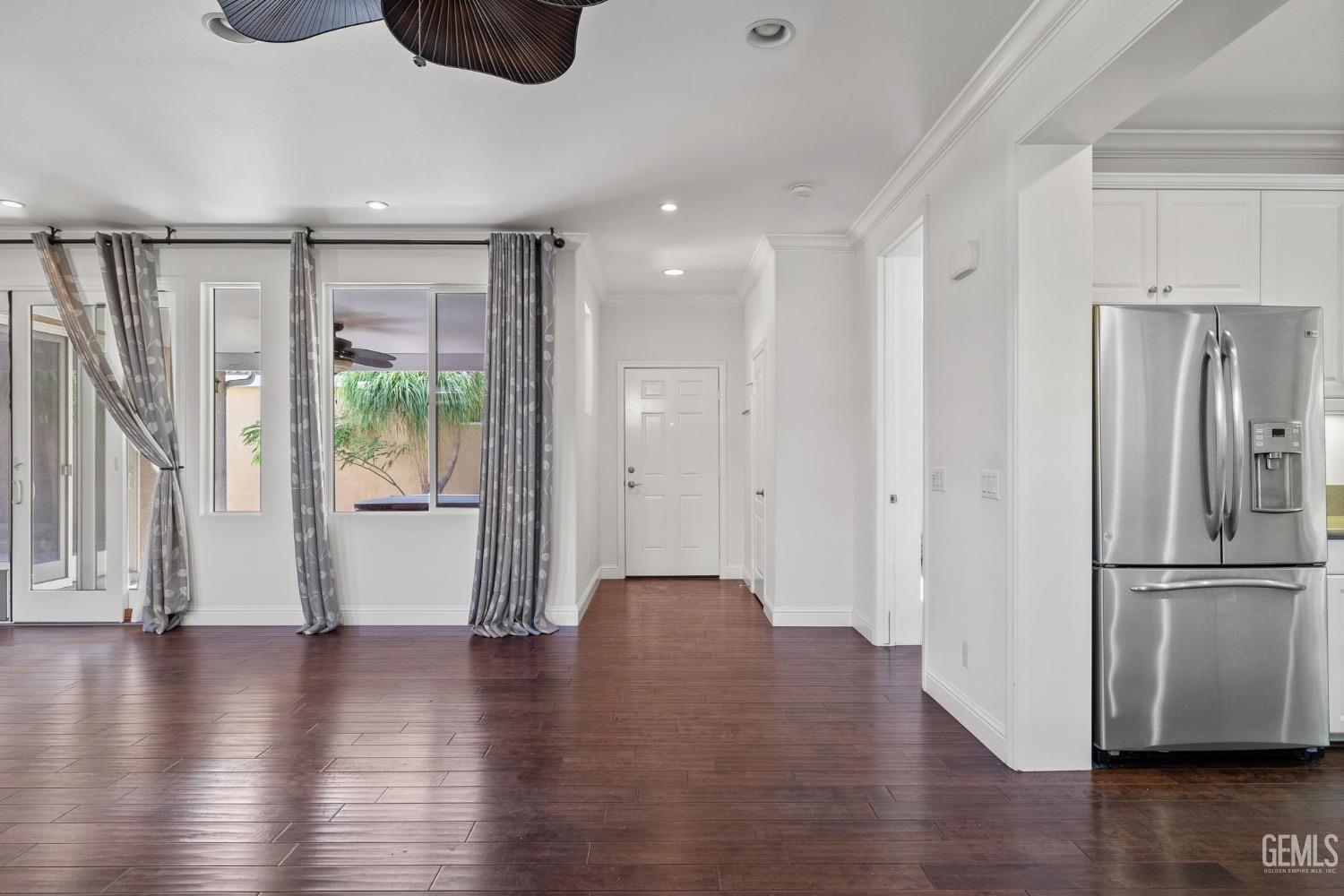 Undisclosed Address Bakersfield, CA 93306 - Photo 18 of 54 a view of an empty room with wooden floor and a window