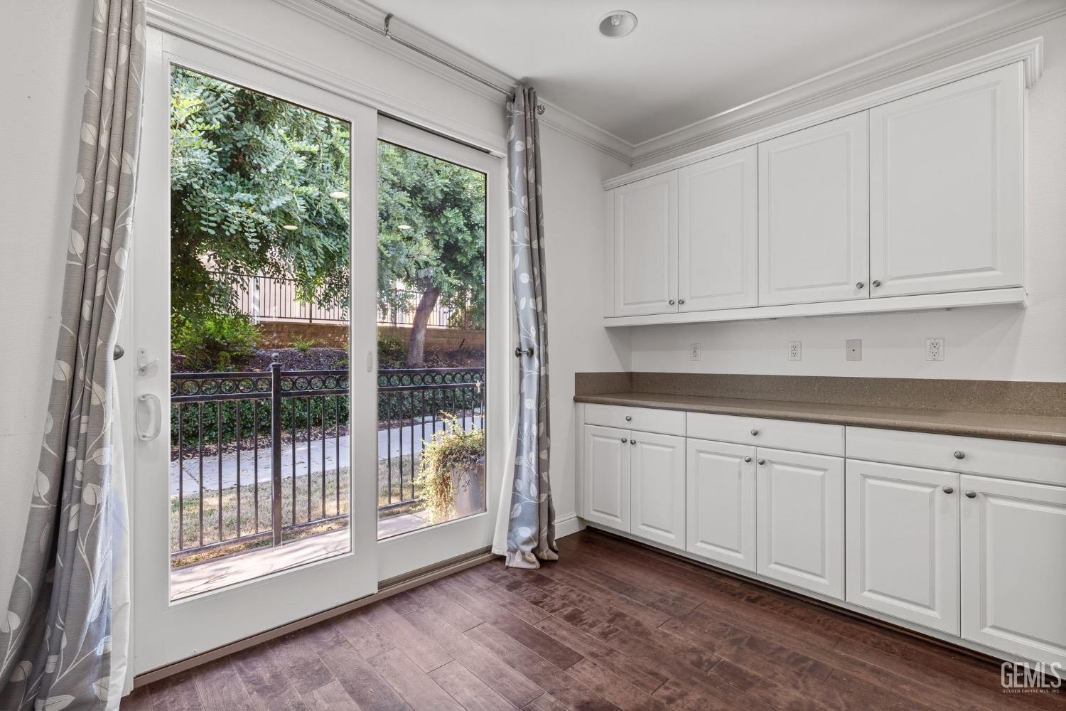 Undisclosed Address Bakersfield, CA 93306 - Photo 19 of 54 a kitchen with granite countertop white cabinets and a window
