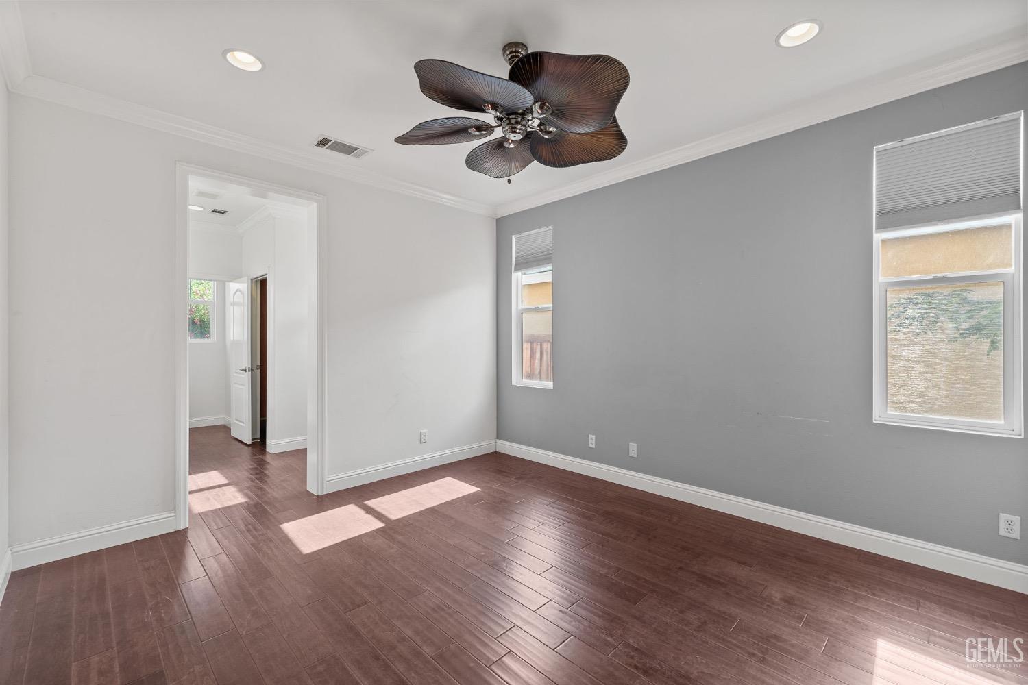 Undisclosed Address Bakersfield, CA 93306 - Photo 21 of 54 a view of an empty room with wooden floor and a window