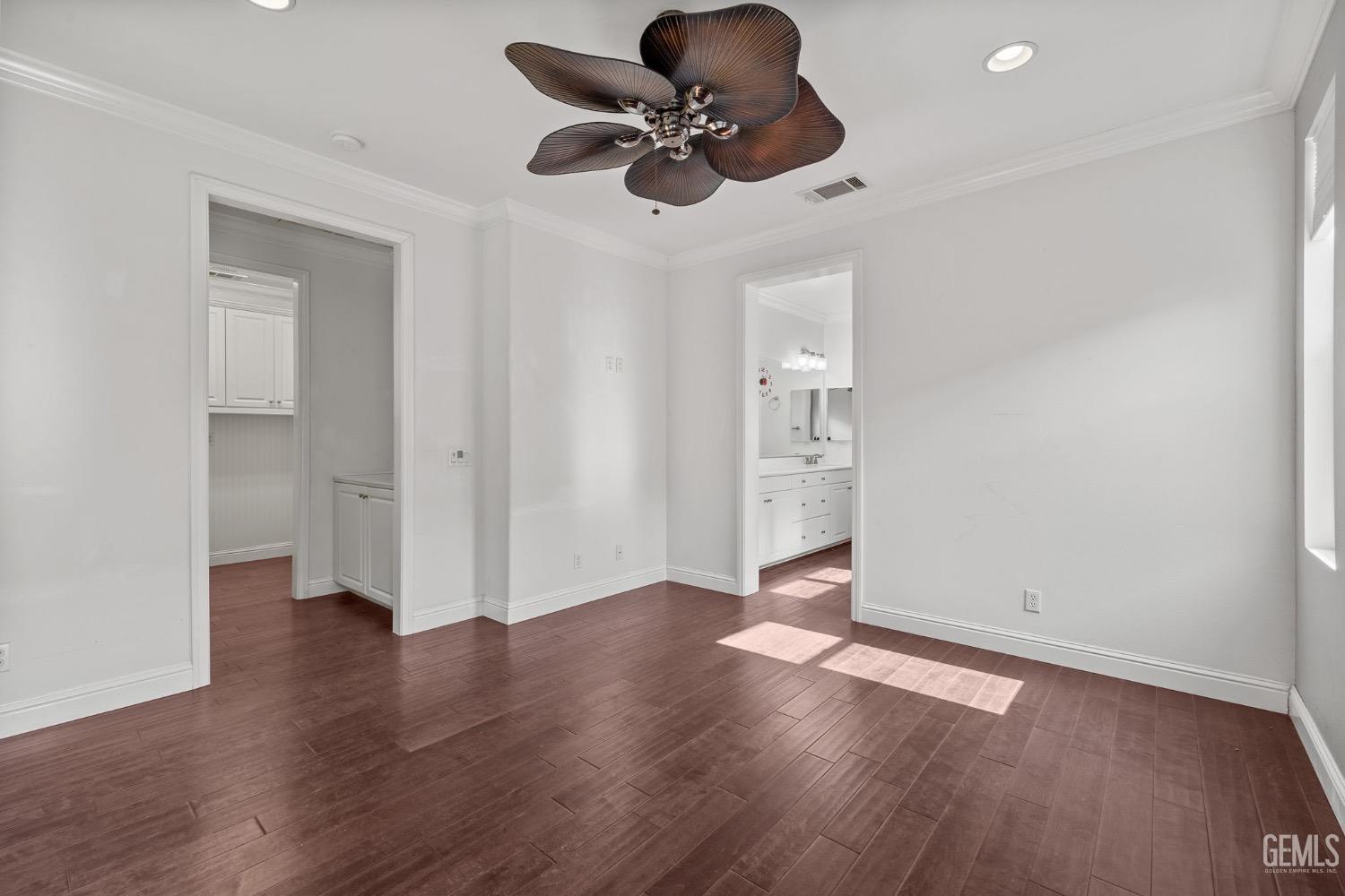 Undisclosed Address Bakersfield, CA 93306 - Photo 24 of 54 an empty room with wooden floor ceiling fan and windows