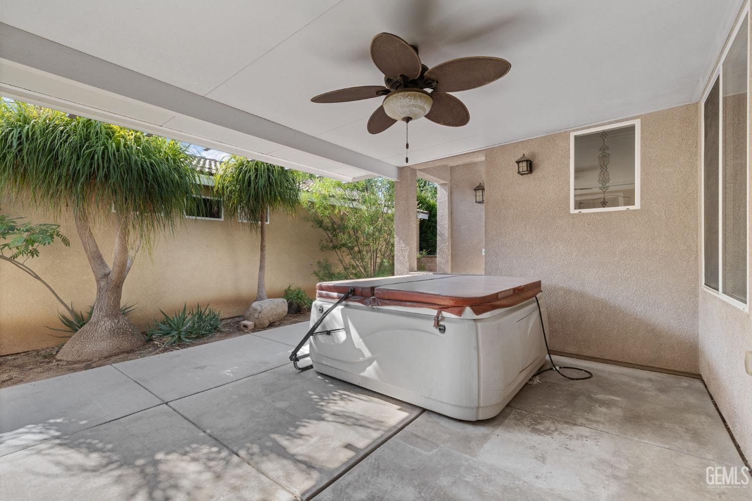 Undisclosed Address Bakersfield, CA 93306 - Photo 38 of 54 a living room with a couch and a ceiling fan