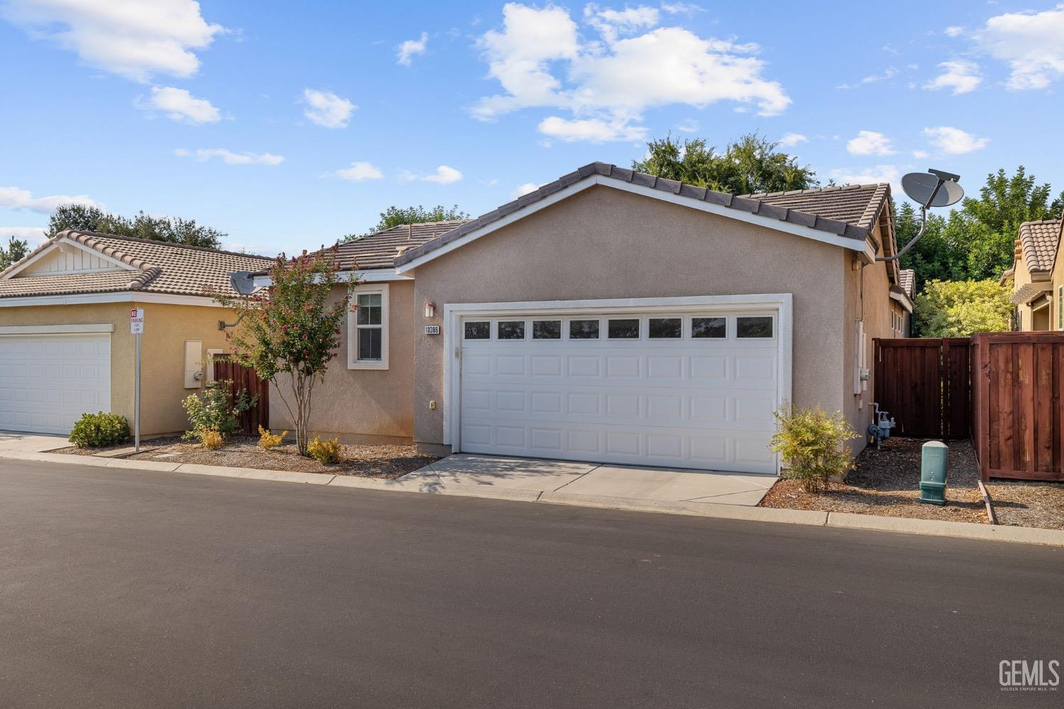 Undisclosed Address Bakersfield, CA 93306 - Photo 39 of 54 front view of a house with a street