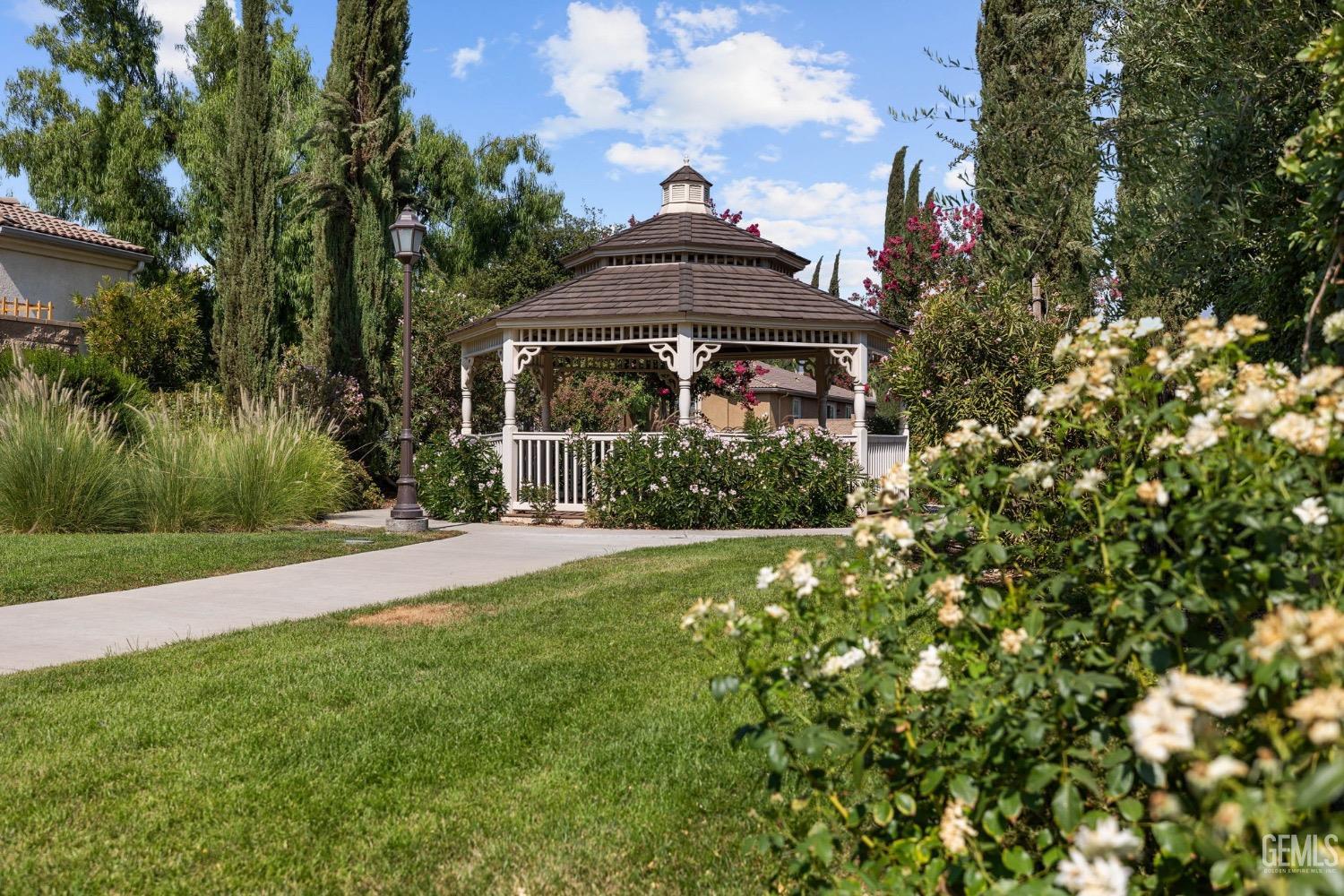 Undisclosed Address Bakersfield, CA 93306 - Photo 42 of 54 a front view of a house with a yard