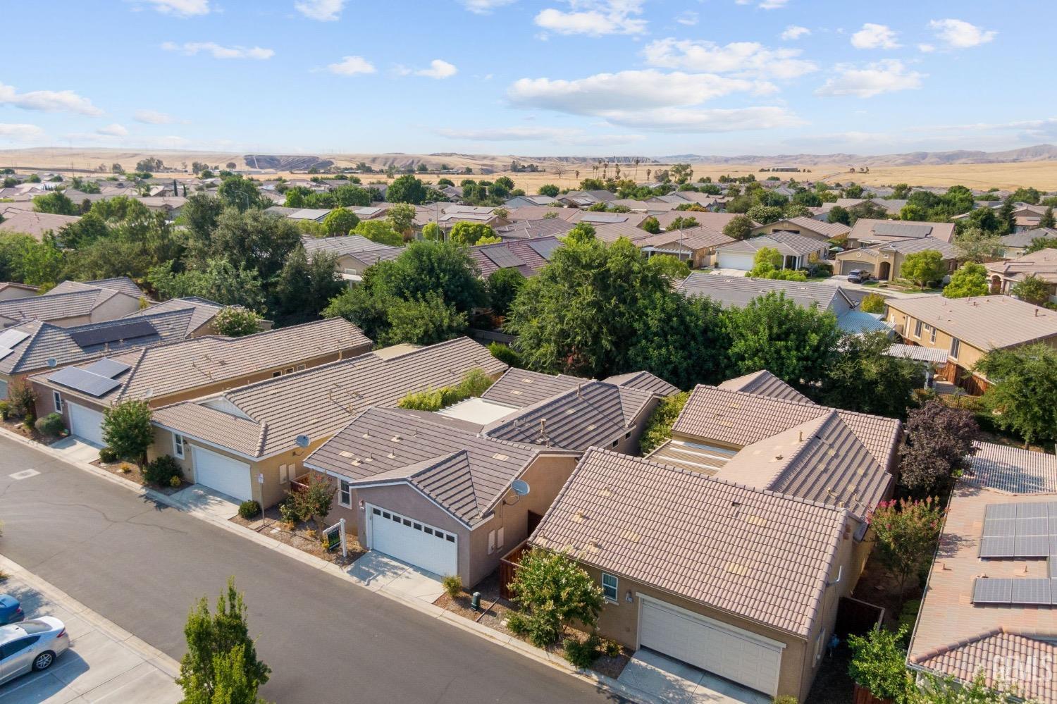 Undisclosed Address Bakersfield, CA 93306 - Photo 44 of 54 an aerial view of a house with a yard garage lake and mountain view in back