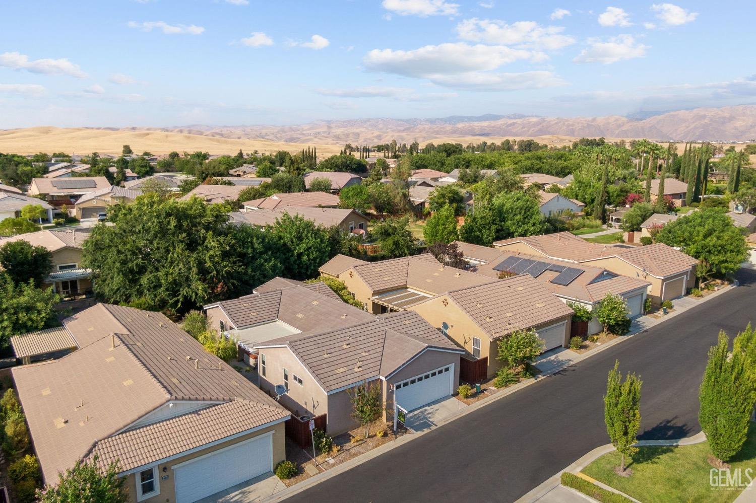 Undisclosed Address Bakersfield, CA 93306 - Photo 45 of 54 an aerial view of a house with a yard