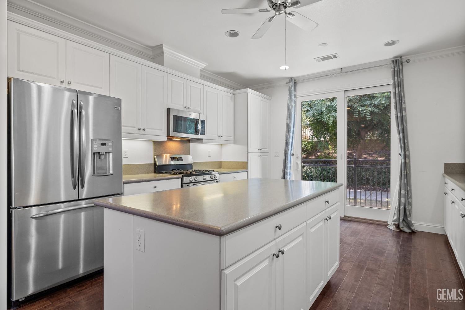 Undisclosed Address Bakersfield, CA 93306 - Photo 8 of 54 a kitchen with stainless steel appliances granite countertop a refrigerator a sink a stove and a refrigerator
