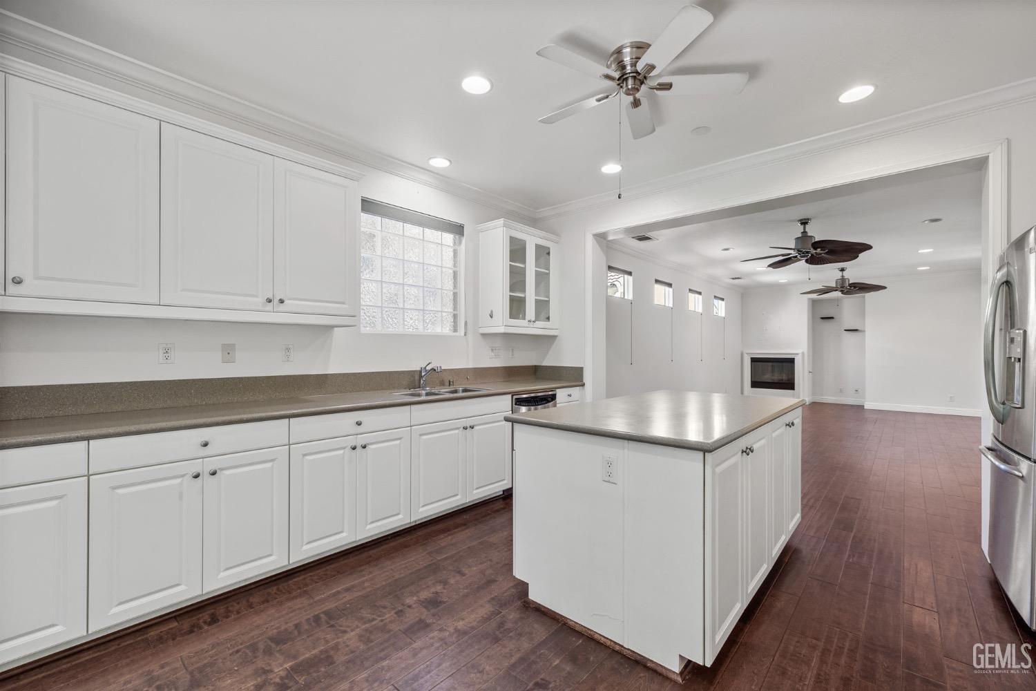 Undisclosed Address Bakersfield, CA 93306 - Photo 9 of 54 a kitchen with granite countertop a sink stainless steel appliances and cabinets