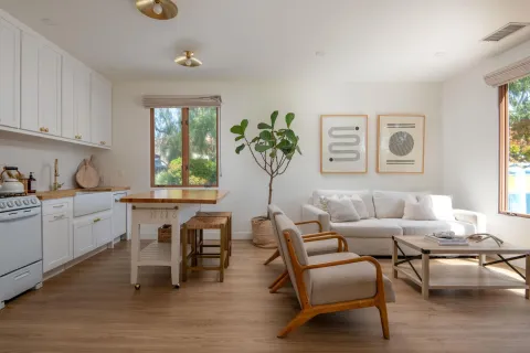 a bedroom with a balcony a bed and a window