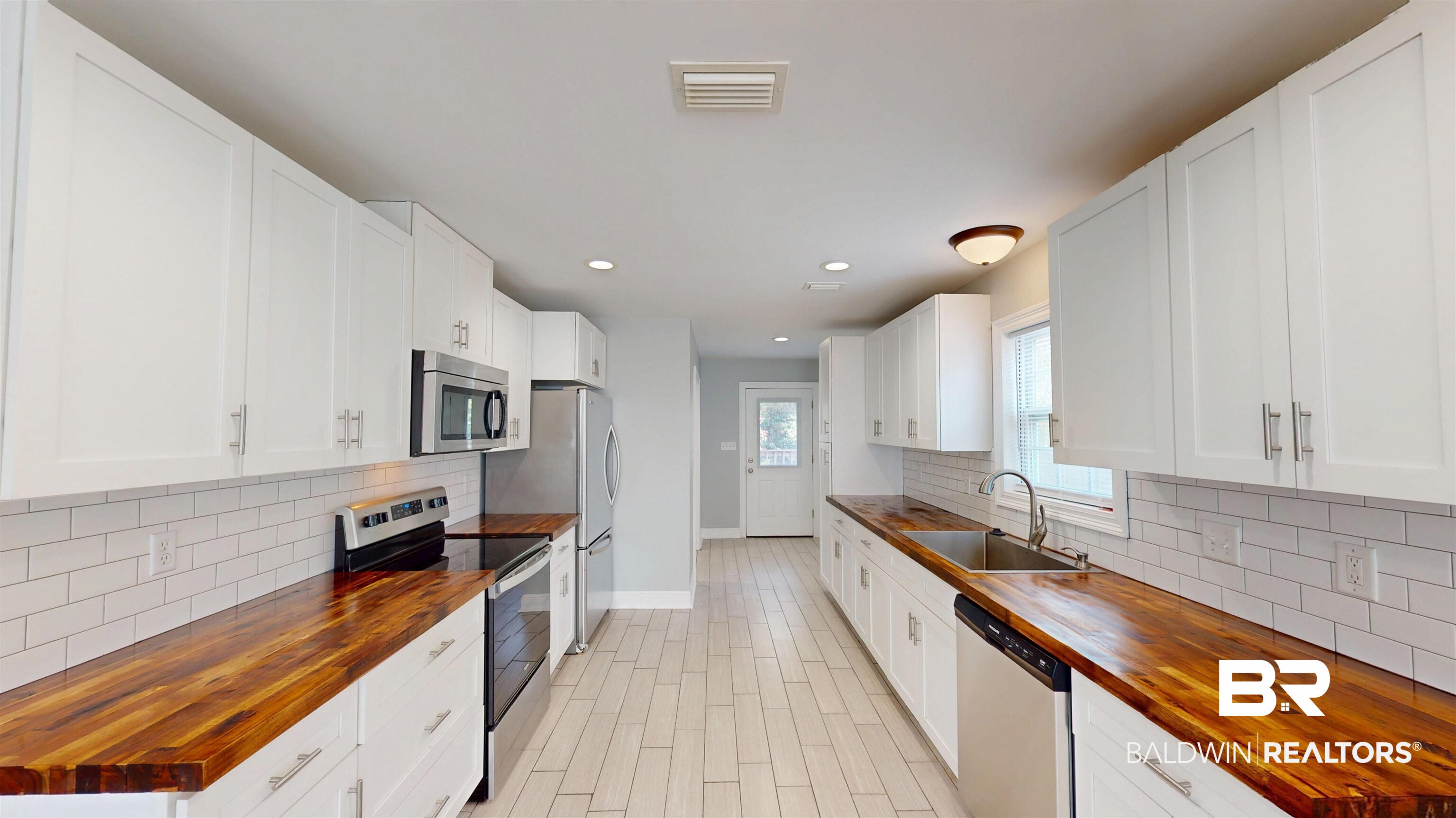 2454 Taylor Avenue Mobile, AL 36606 - Photo 8 of 24 Kitchen featuring wood counters, stainless steel appliances, white cabinetry, decorative backsplash, and recessed lighting