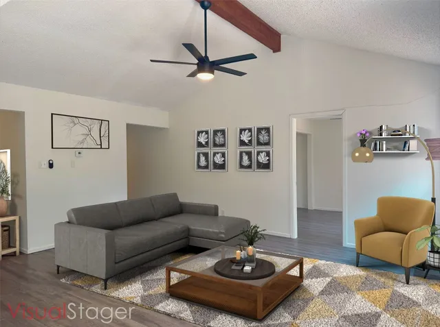 a living room with furniture and a rug