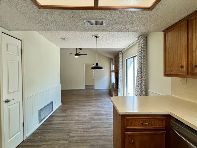 a kitchen with a sink and refrigerator