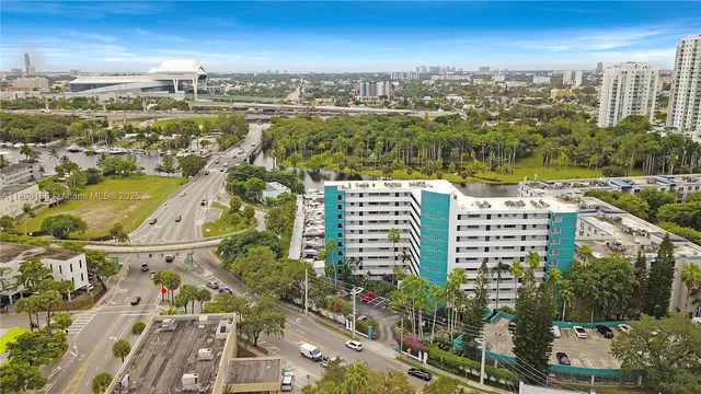 an aerial view of city and lake