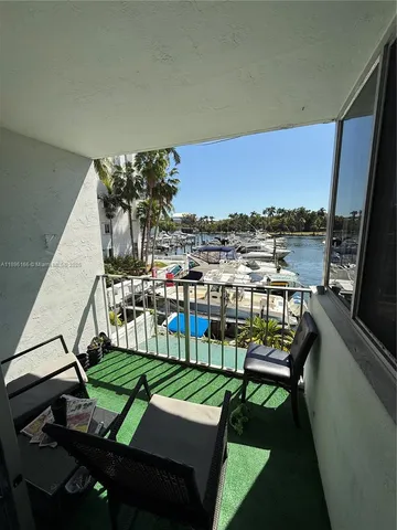 a view of a chairs and table in patio