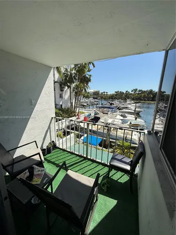 a view of a chairs and table in patio