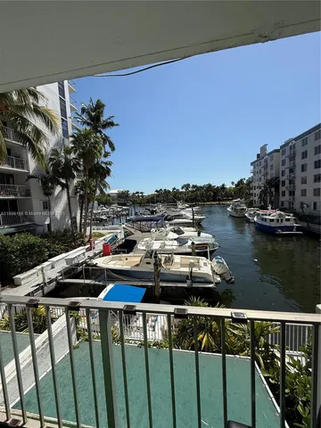 a view of roof deck with wooden floor and seating space